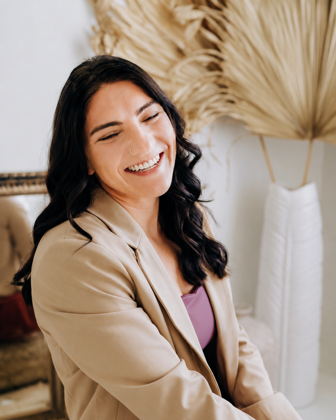 Krissy Coleman smiling in a warm editorial portrait